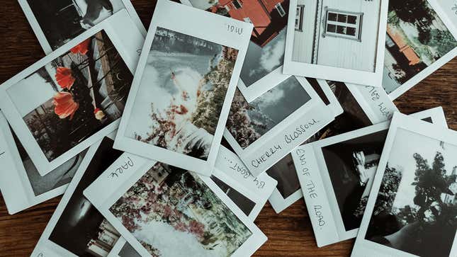 A stack of printed out polaroid pictures