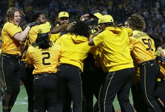 Jun 30, 2023; Pittsburgh, Pennsylvania, USA; The Pittsburgh Pirates celebrate a walk-off two-run home run by first baseman Carlos Santana (hidden) to defeat the Milwaukee Brewers at PNC Park.