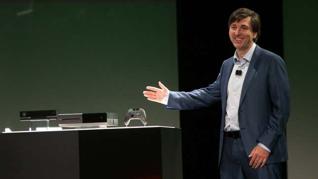 Don Mattrick shows off the Xbox One on a stage.