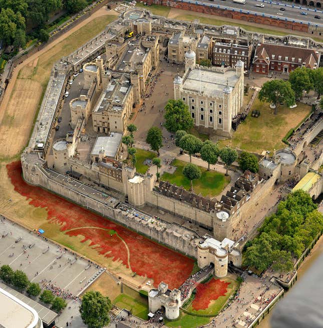 A sea of red ceramic poppies which form part of an art installation to commemorate World War I is seen in the dry moat of the Tower of London in London, Monday, Aug. 4, 2014. The installation of 888,246 ceramic poppies by ceramic artist Paul Cummins and entitled "Blood Swept Lands and Seas of Red" will be unveiled on August 5 to mark the centenary of World War I, with the final one being planted on Armistice Day on November 11. Each poppy represents a British military fatality from World War I. (AP Photo/Rob Taggart)