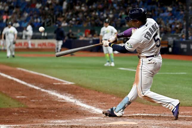 Aug 11, 2023; St. Petersburg, Florida, USA; Tampa Bay Rays shortstop Wander Franco (5) hits a walk off home run in the ninth inning against the Cleveland Guardians at Tropicana Field.