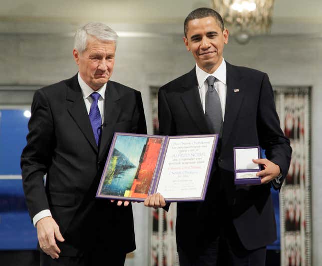 In this Dec. 10, 2009, file photo, President and Nobel Peace Prize laureate Barack Obama poses with his medal and diploma alongside Nobel committee chairman Thorbjorn Jagland at the Nobel Peace Prize ceremony at City Hall in Oslo, Norway.