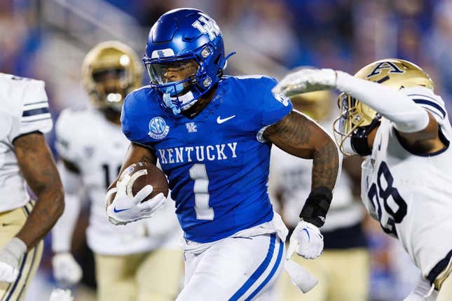 Sep 16, 2023; Lexington, Kentucky, USA; Kentucky Wildcats running back Ray Davis (1) carries the ball into the end zone and scores a touchdown during the fourth quarter against the Akron Zips at Kroger Field.