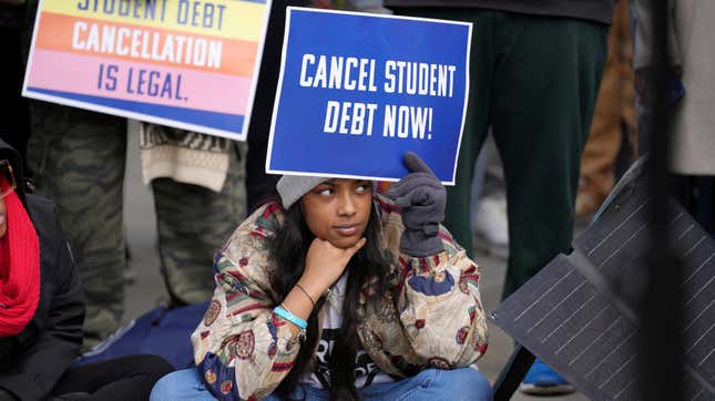 A supporter of student loan debt relief rallies in front of the Supreme Court as the justices are scheduled to hear oral arguments in two cases involving President Joe Biden's bid to reinstate his plan to cancel billions of dollars in student debt in Washington, U.S., February 28, 2023. 