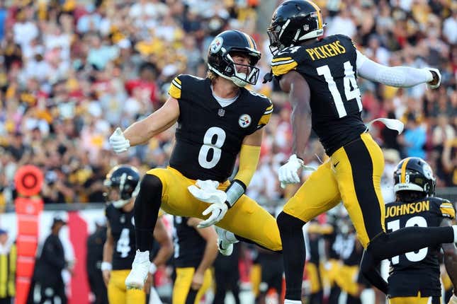 Aug 11, 2023; Tampa, Florida, USA; Pittsburgh Steelers wide receiver George Pickens (14) celebrates with quarterback Kenny Pickett (8)  after scoring a touchdown against the Tampa Bay Buccaneers during the first quarter at Raymond James Stadium.