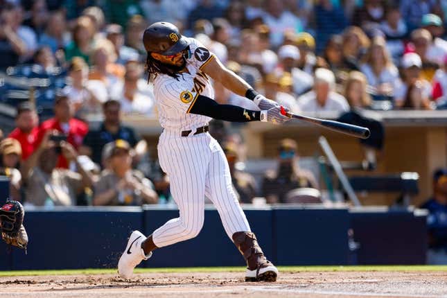 Jun 17, 2023; San Diego, California, USA;  San Diego Padres right fielder Fernando Tatis Jr. (23) hits a double in the first inning against the Tampa Bay Rays at Petco Park.