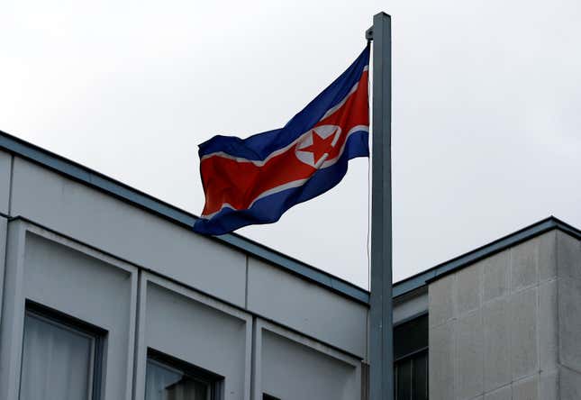 North Korea’s flag, with a red stripe and star for Communism.