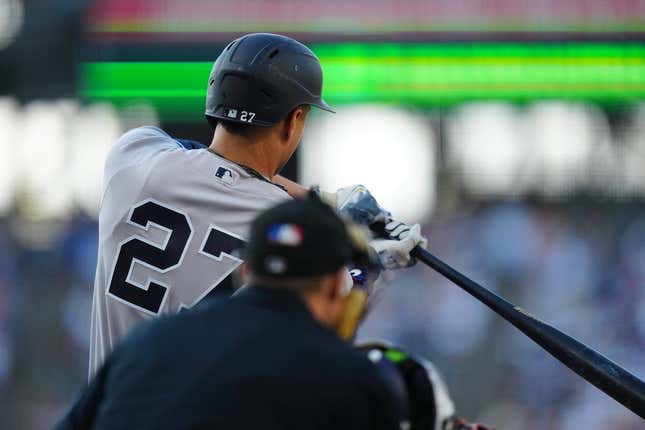 Jul 14, 2023; Denver, Colorado, USA; New York Yankees right fielder Giancarlo Stanton (27) hits a two run home run in the first inning against the Colorado Rockies at Coors Field.
