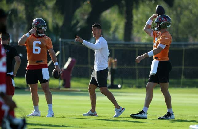 Jul 30, 2023; Tampa, FL, USA; Tampa Bay Buccaneers offensive coordinator Dave Canales talks with quarterback Baker Mayfield (6) and quarterback Kyle Trask (2) during training camp at AdventHealth Training Center.