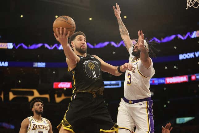 Mar 5, 2023; Los Angeles, California, USA; Golden State Warriors guard Klay Thompson (11) goes to the basket against Los Angeles Lakers forward Anthony Davis (3) during the first quarter at Crypto.com Arena.