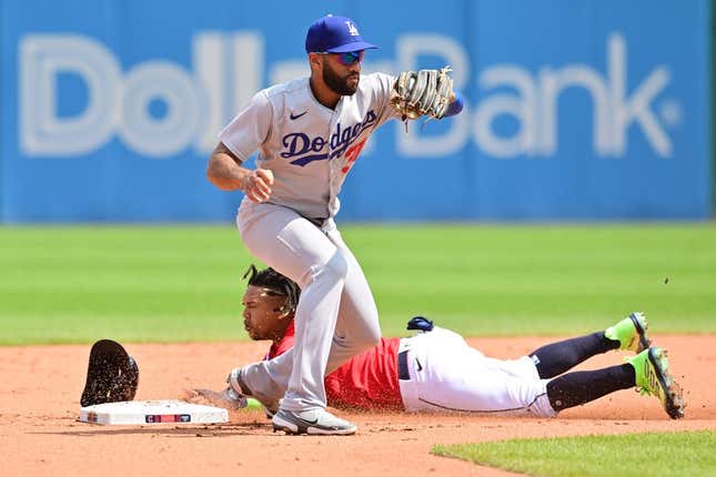 Aug 24, 2023; Cleveland, OH, USA; Cleveland Guardians third baseman Jose Ramirez (11) steals second as Los Angeles Dodgers second baseman Amed Rosario (31) catches the throw during the third inning at Progressive Field.
