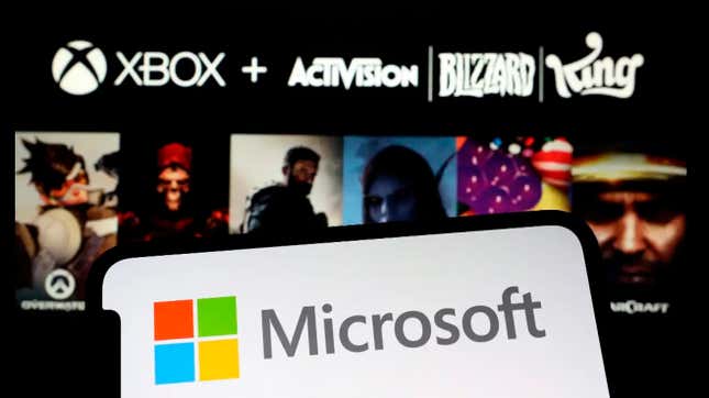 A photo shows Microsoft's logo and Activision Blizzard game art.