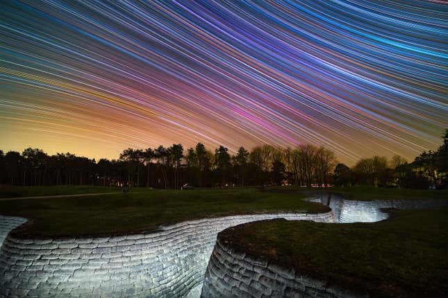 Vivid streaks of stars above a French war memorial.