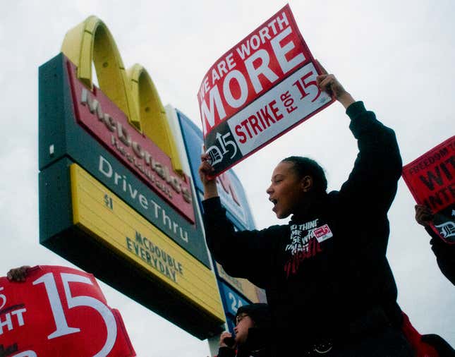 Fast-food worker Michelle Osborn, 23, of Flint shouts out chants as she and a few dozen others strike outside of McDonald&#039;s on Wednesday, July 31, 2013 in Flint. Some fast food restaurant workers have walked off the job in the Detroit area as part of an effort to push for higher wages. Organizers say they began the walkout at restaurants in Lincoln Park and Southfield on Tuesday night. Workers in Flint hit the street Wednesday outside a McDonald&#039;s, saying they want wages &quot;super-sized.&quot; Workers want $15 and hour, better working conditions and the right to unionize. The restaurant industry says higher wages would hurt job creation. The actions follow strikes this week in other parts of the country.