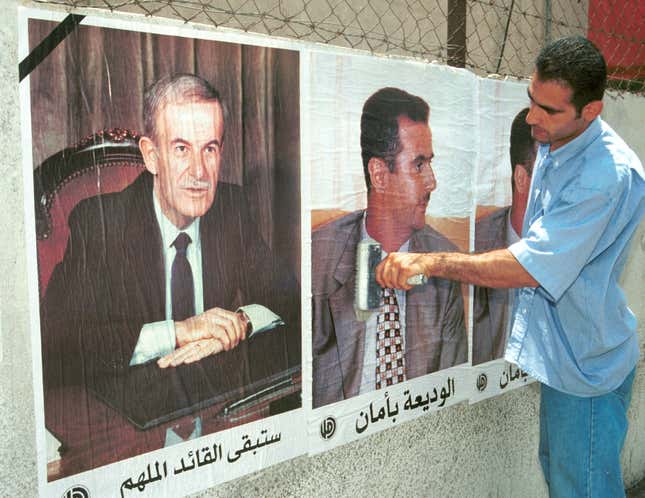 A picture of new Syrian president Bashar al-Assad is pasted alongside one of his dead father in 2000.