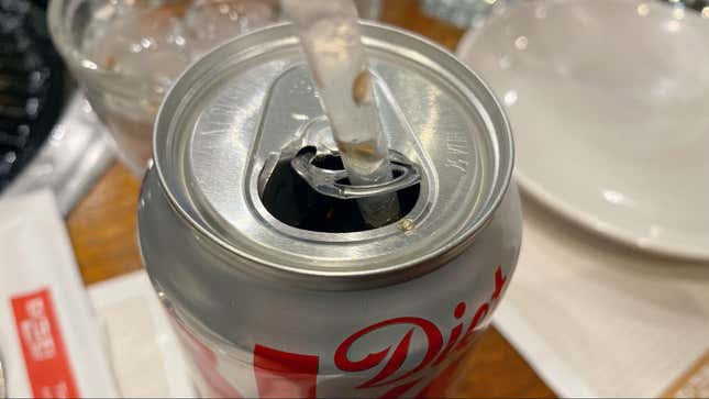 Image for article titled How to Keep a Straw From Floating Out of Your Soda Can
