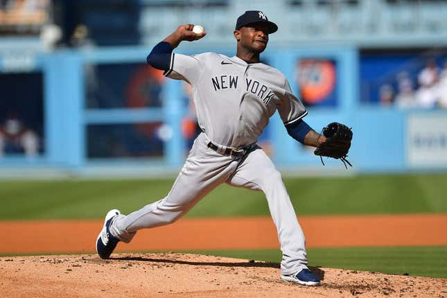 Jun 4, 2023; Los Angeles, California, USA; New York Yankees starting pitcher Domingo German (0) throws against the Los Angeles Dodgers during the second inning at Dodger Stadium.