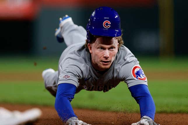 Sep 11, 2023; Denver, Colorado, USA; Chicago Cubs outfielder Pete Crow-Armstrong (52) attempts to steal third base in the seventh inning against the Colorado Rockies at Coors Field.