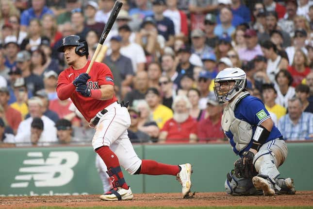 Aug 5, 2023; Boston, Massachusetts, USA;  Boston Red Sox third baseman Luis Urias (17) hits an RBI single during the ninth inning against the Toronto Blue Jays at Fenway Park.