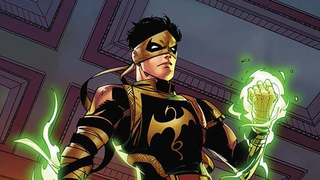 Marvel's new Iron Fist character, standing over someone with his fists glowing. 