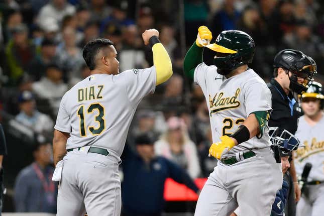 Aug 29, 2023; Seattle, Washington, USA; Oakland Athletics third baseman Jordan Diaz (13) and catcher Shea Langeliers (23) celebrate after Langeliers hit a 2-run home run against the Seattle Mariners during the second inning at T-Mobile Park.