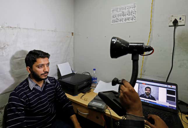 A man goes through the process of eye scanning for the Unique Identification database system, also known as Aadhaar, at a registration centre in New Delhi