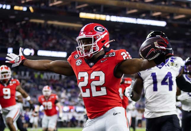 Jan 9, 2023; Inglewood, CA, USA; Georgia Bulldogs running back Branson Robinson (22) celebrates as he scores a rushing touchdown against the TCU Horned Frogs during the CFP national championship game at SoFi Stadium.