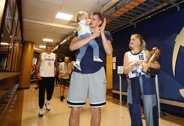 Jun 12, 2023; Denver, Colorado, USA; Denver Nuggets center Nikola Jokic (15) celebrates with his family after the Nuggets won the NBA championship by defeating the Miami Heat in game five of the 2023 NBA Finals at Ball Arena.