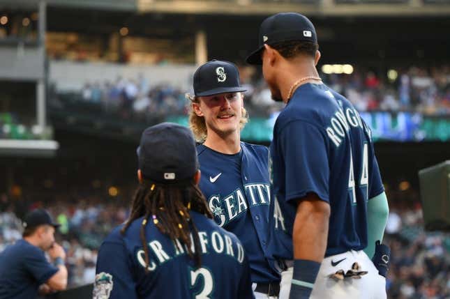 Jun 12, 2023; Seattle, Washington, USA; Seattle Mariners starting pitcher Bryce Miller (50) talks with shortstop J.P. Crawford (3) and center fielder Julio Rodriguez (44) during the seventh inning against the Miami Marlins at T-Mobile Park.