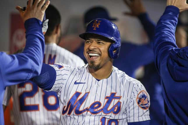 May 16, 2023; New York City, New York, USA; New York Mets third baseman Eduardo Escobar (10) is greeted in the dugout after hitting a pinch hit two run home run in the ninth inning against the Tampa Bay Rays at Citi Field.