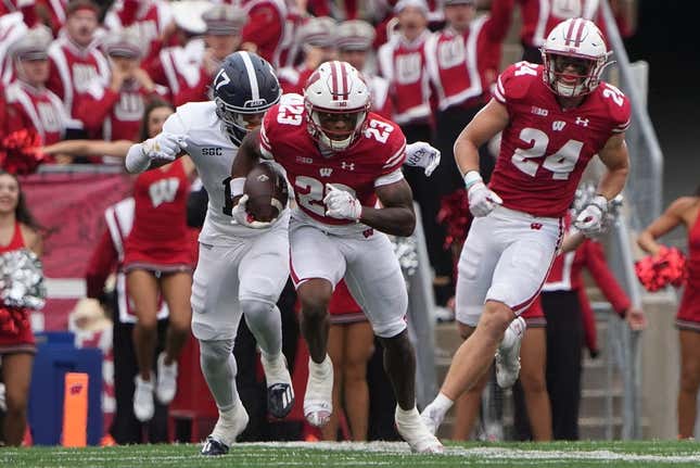 Sep 16, 2023; Madison, Wisconsin, USA; Wisconsin Badgers cornerback Jason Maitre (23) returns an interception against Georgia Southern Eagles during the second quarter at Camp Randall Stadium.