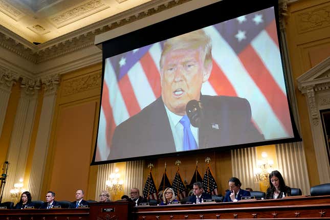 A video of former President Donald Trump is shown on a screen, as the House select committee investigating the Jan. 6 attack on the U.S. Capitol holds its final meeting on Capitol Hill in Washington, Monday, Dec. 19, 2022. From left to right, Rep. Stephanie Murphy, D-Fla., Rep. Pete Aguilar, D-Calif., Rep. Adam Schiff, D-Calif., Rep. Zoe Lofgren, D-Calif., Chairman Bennie Thompson, D-Miss., Vice Chair Liz Cheney, R-Wyo., Rep. Adam Kinzinger, R-Ill., Rep. Jamie Raskin, D-Md., and Rep. Elaine Luria, D-Va.