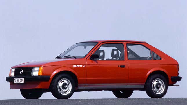 A photo of a red Opel Kadett hatchback. 