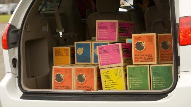 Girl Scout Cookies boxes in back of minivan