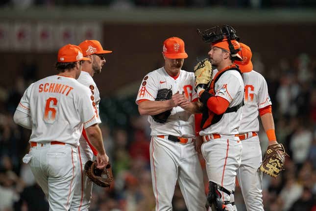 Aug 29, 2023; San Francisco, California, USA;  San Francisco Giants starting pitcher Alex Cobb (38) talks it over with San Francisco Giants catcher Patrick Bailey (14) and teammates during the ninth inning against the Cincinnati Reds at Oracle Park.