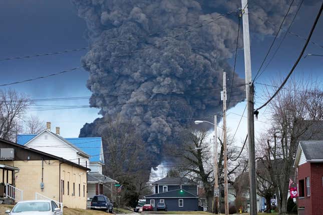 FILE - A black plume rises over East Palestine, Ohio, as a result of a controlled detonation of a portion of the derailed Norfolk Southern trains, Feb. 6, 2023. Norfolk Southern announced new details Monday, Sept. 18, about its plan to compensate East Palestine residents for lost home values since the fiery derailment disrupted life in the eastern Ohio town in February. (AP Photo/Gene J. Puskar, File)
