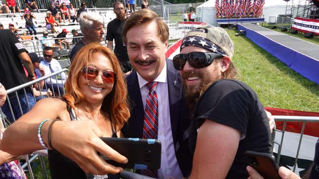 Mike Lindell, the CEO of MyPillow, taking selfie with Donald Trump supporters before a rally in Wellington, Ohio on June 26, 2021.