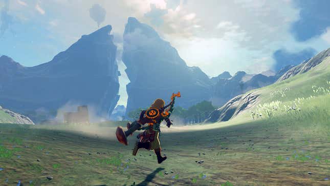 Link runs across the plains of Hyrule with a mountain the distance.