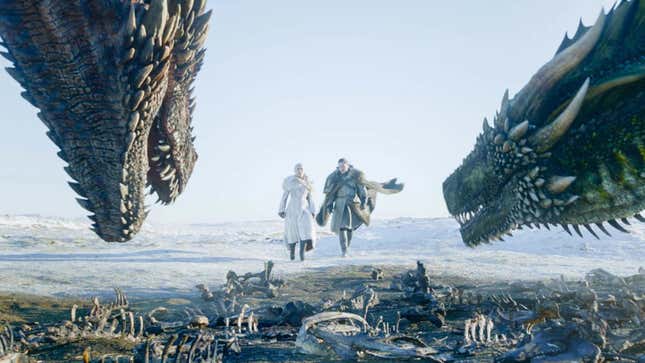 Game of Thrones' Dany and Jon walk toward two dragons who are lurking over a pile of bones.