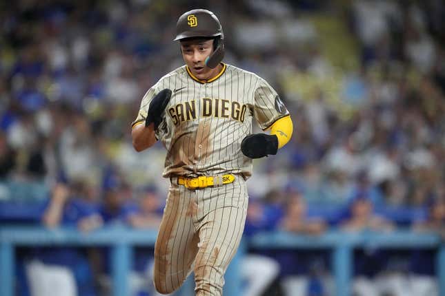 Sep 11, 2023; Los Angeles, California, USA; San Diego Padres second baseman Ha-Seong Kim (7) scores in the first inning against the Los Angeles Dodgers at Dodger Stadium.