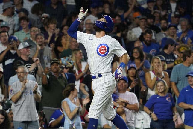 Aug 1, 2023; Chicago, Illinois, USA; Chicago Cubs shortstop Dansby Swanson (7) gestures after hitting a two-run homer against the Cincinnati Reds during the fourth inning at Wrigley Field.