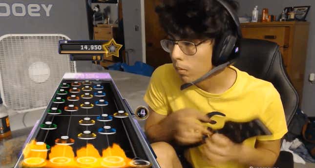 A Guitar Hero player looks at the incoming notes.