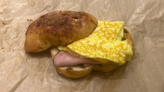 Panera's Cinnamon Crunch Bagel Breakfast Sandwich with top of bagel lifted off