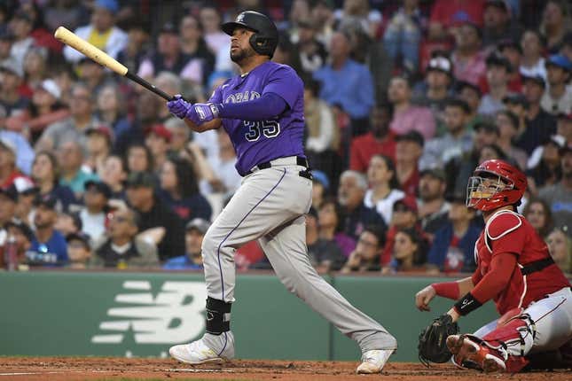 Jun 13, 2023; Boston, Massachusetts, USA; Colorado Rockies catcher Elias Diaz (35) hits an RBI double during the third inning against the Boston Red Sox at Fenway Park.