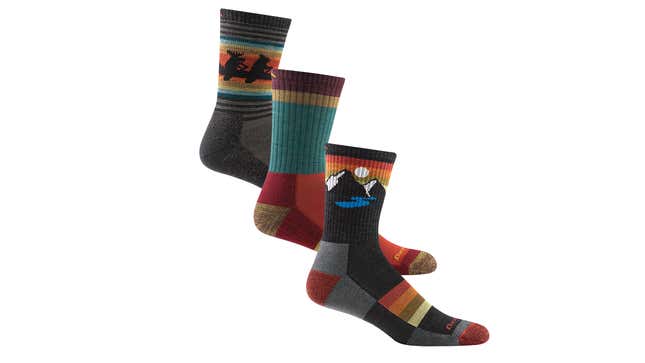 3 pairs of Darn Tough socks in different colors and patterns