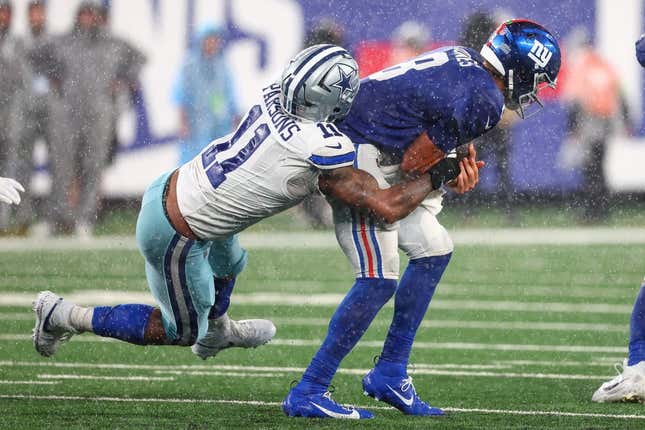 Sep 10, 2023; East Rutherford, New Jersey, USA; New York Giants quarterback Daniel Jones (8) is sacked by Dallas Cowboys linebacker Micah Parsons (11) during the second half at MetLife Stadium.