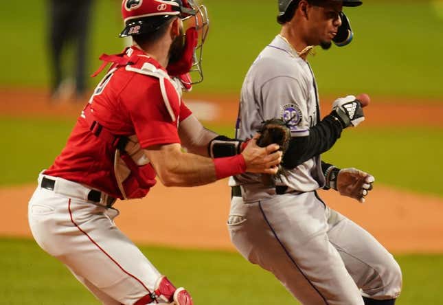 Jun 14, 2023; Boston, Massachusetts, USA; Colorado Rockies shortstop Ezequiel Tovar (14) tagged out at home plate by Boston Red Sox catcher Connor Wong (12) in the first inning at Fenway Park.