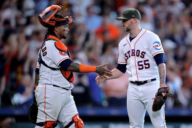 May 20, 2023; Houston, Texas, USA; Houston Astros relief pitcher Ryan Pressly (55) shakes hands with Houston Astros catcher Martin Maldonado (15) after the final out against the Oakland Athletics during the ninth inning at Minute Maid Park.