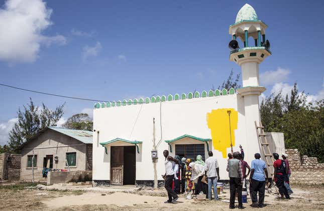 A mosque in Mombasa being painted yellow.