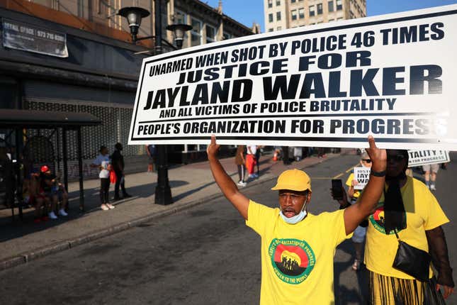 People march demanding justice for Jayland Walker on Market Street on July 15, 2022, in Newark, New Jersey. The People’s Organization for Progress (POP) organized a march and rally to demand justice for Jayland Walker, who was killed in Akron, Ohio, by police on June 27, 2022. According to a medical examiner’s report released today, Walker, who was unarmed at the time, suffered 46 gunshot wounds after multiple police officers shot at him an estimated 90 times following a car chase. The family held an open casket funeral for Walker on July 13th, and drew comparisons to a choice by Emmett Till’s mother 67 years ago that helped galvanize the national Civil Rights Movement. 